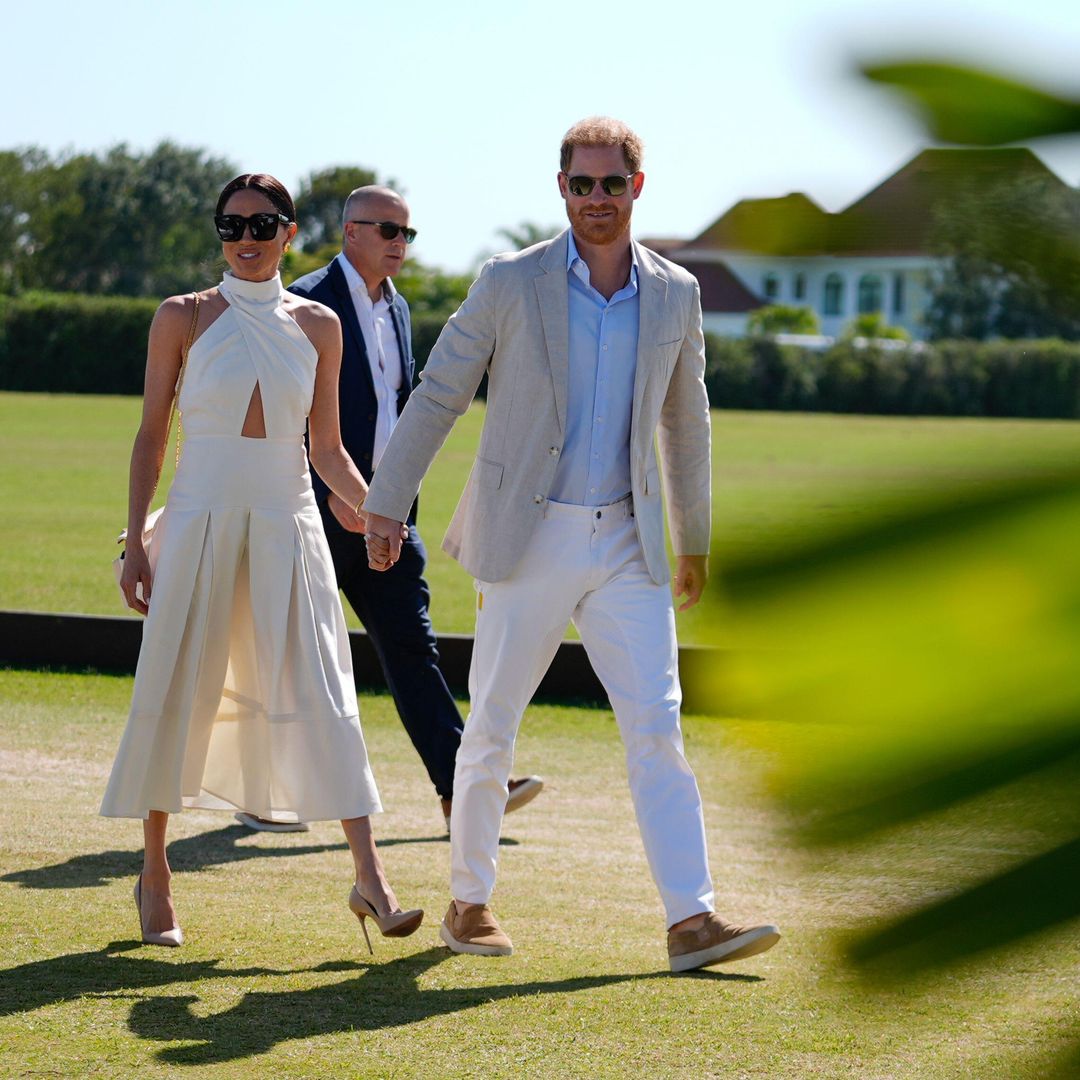 Meghan Markle has never looked better in daring halterneck outfit as she supports husband Prince Harry